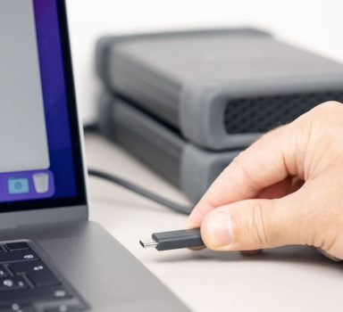 hand-connecting-a-external-hard-disk-to-a-modern-l-2025-02-11-21-55-03-utc